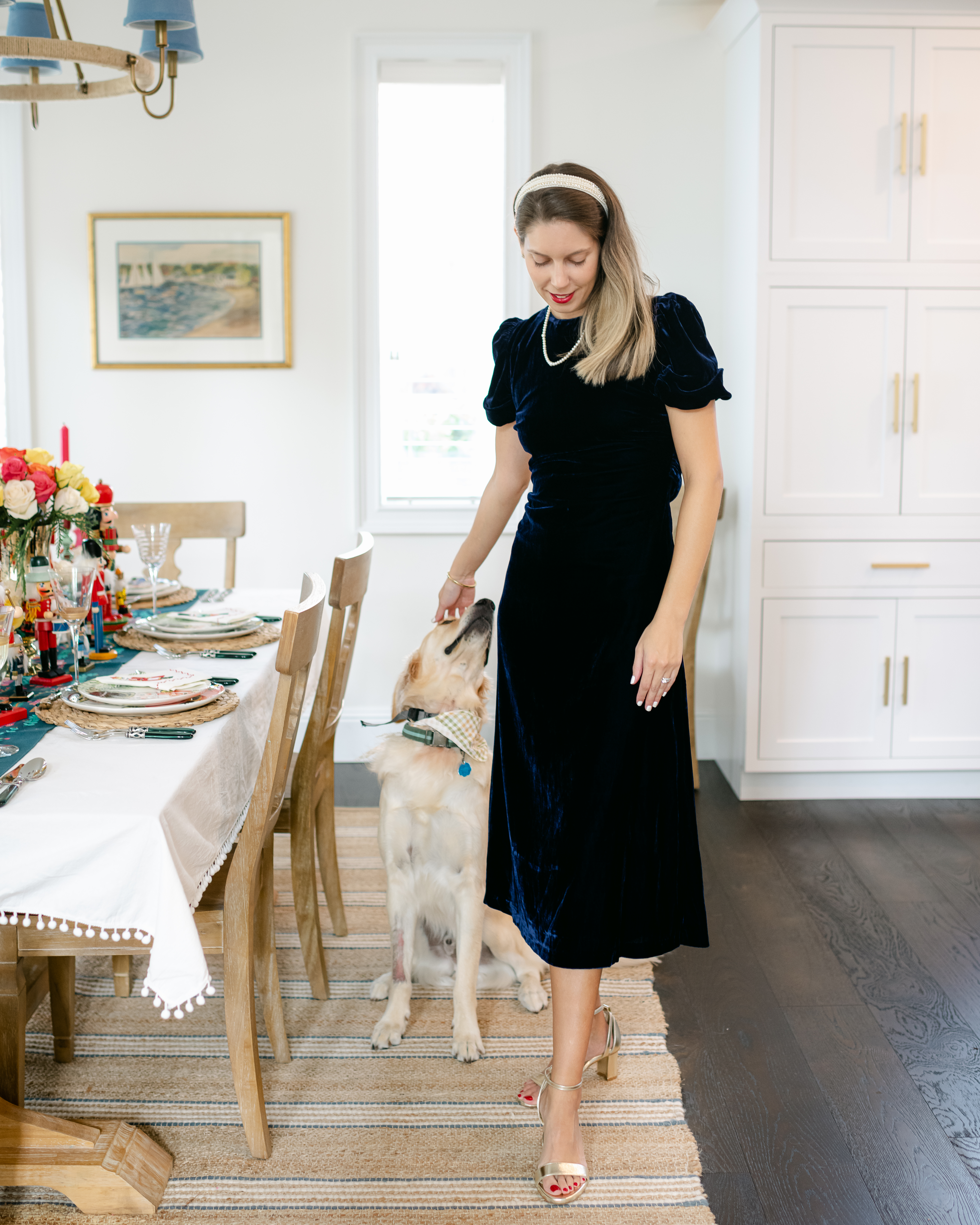 A deep navy velour dress and pearl details