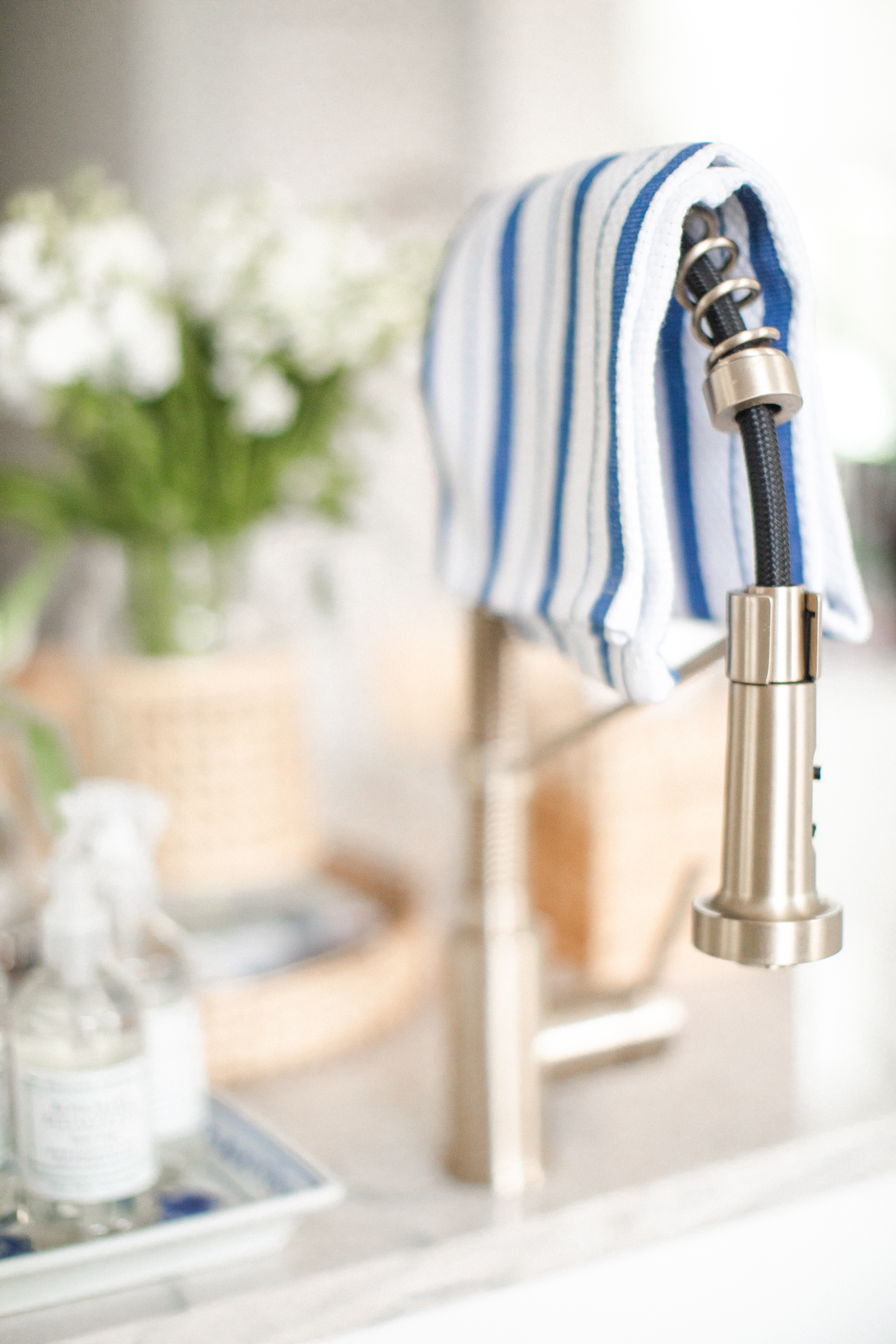 Kitchen sink faucet with dish towel hanging